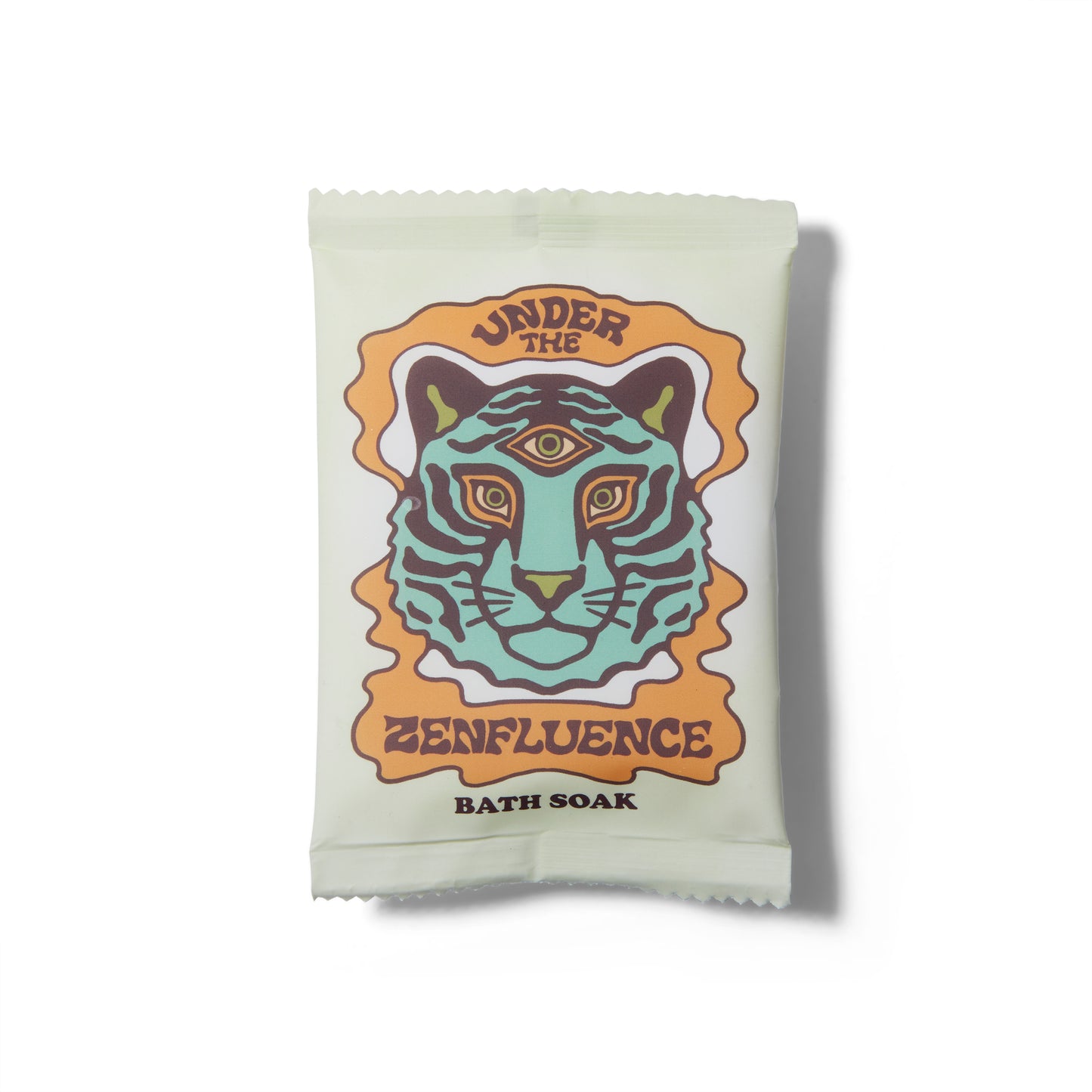 The Wild Yonder Organic Bath Salts in Under The Zenfluence. There is an illustration of a three eyed tiger on the package. 
