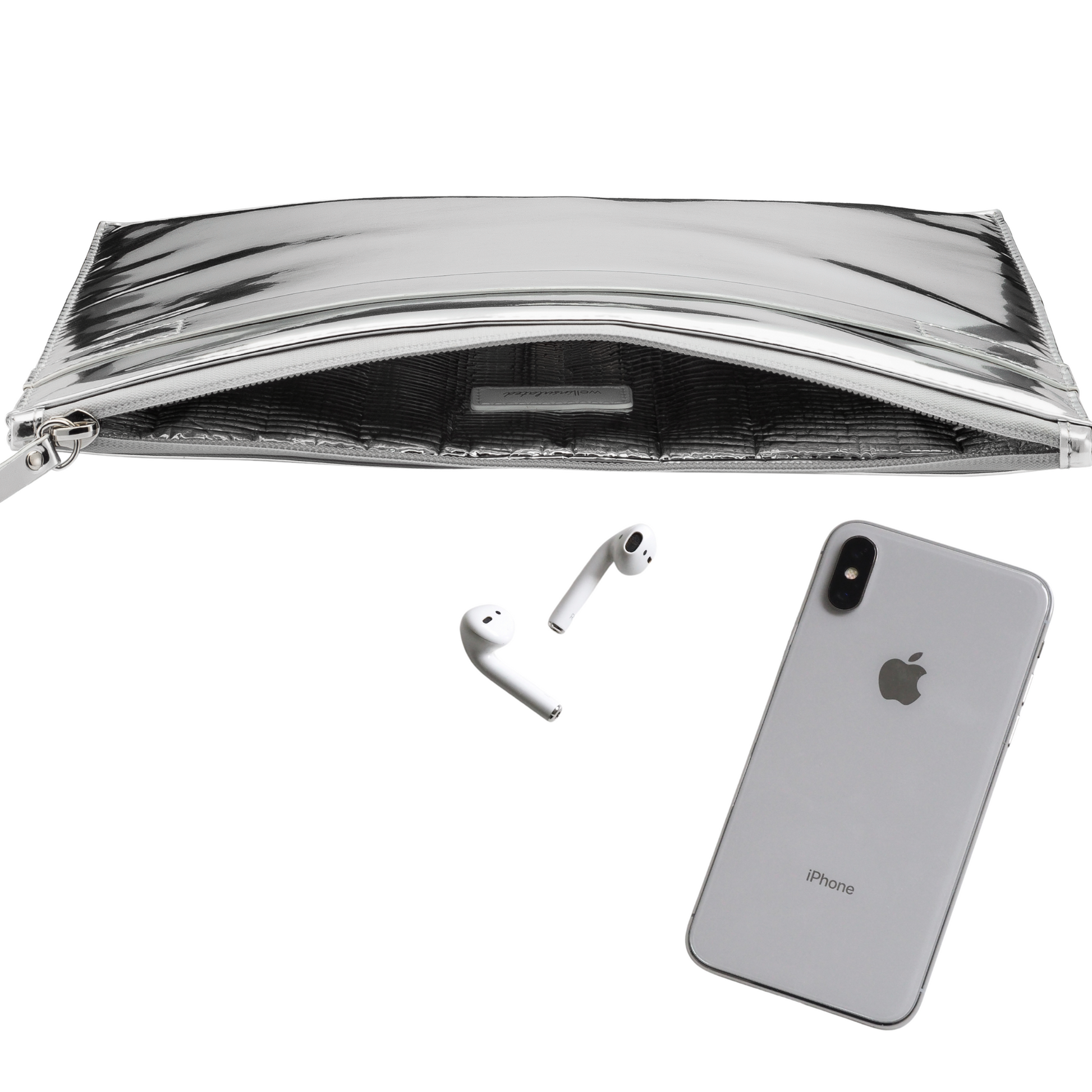Side view of the inside of the Performance Tech Pouch. The silver pouch is open showing the silver interior of the bag. There is an iPhone and ear buds near the bag.